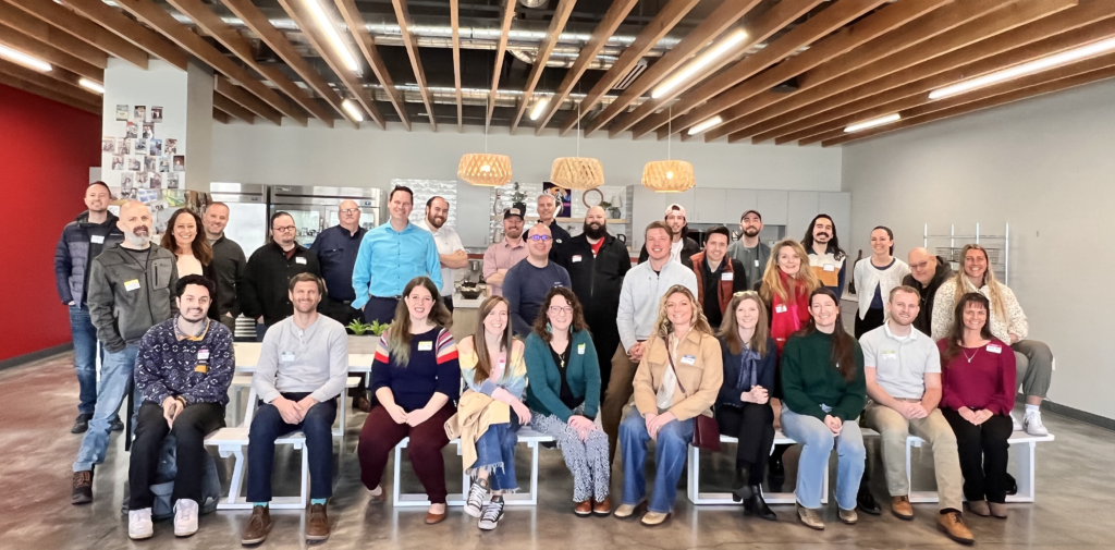 Group photo of Utah Marketing Group members sitting and standing in rows.