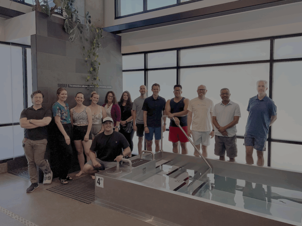 Utah Marketing Group members standing around a cold pool at PLUNJ Salt Lake.