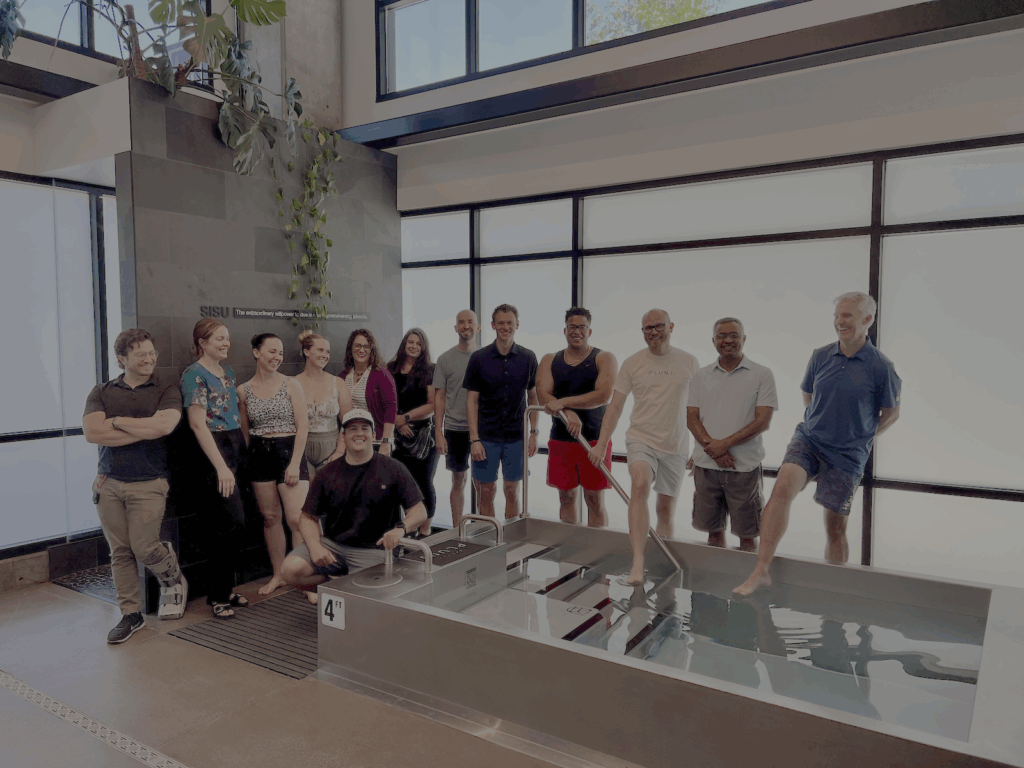 Utah Marketing Group members standing around a cold pool at PLUNJ Salt Lake.